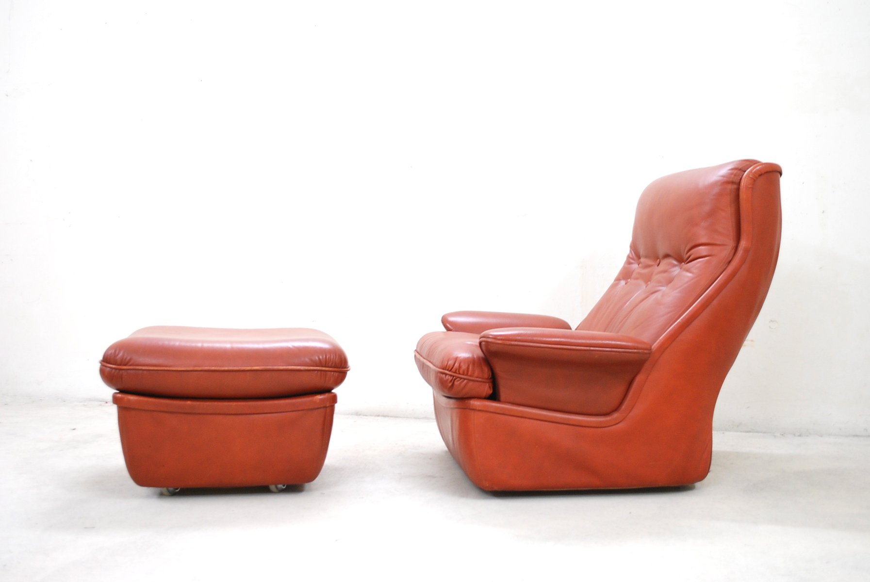 red leather lounge chairs and ottoman from airborne 5