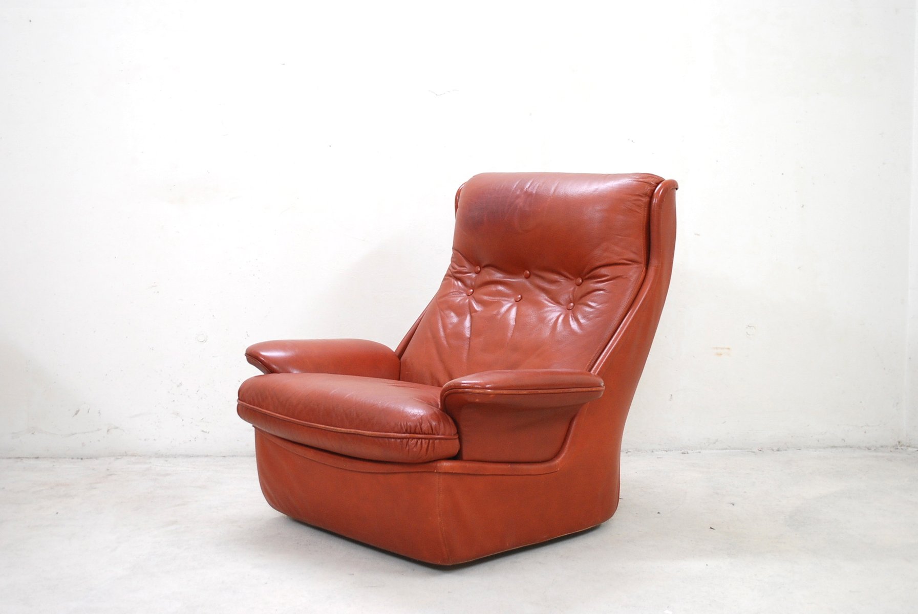 red leather lounge chairs and ottoman from airborne 34
