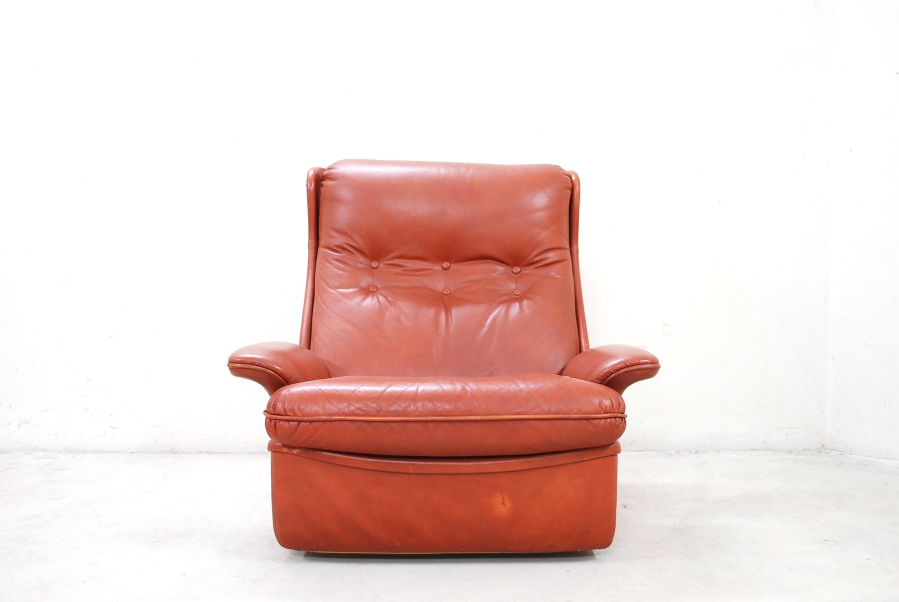 red leather lounge chairs and ottoman from airborne 6