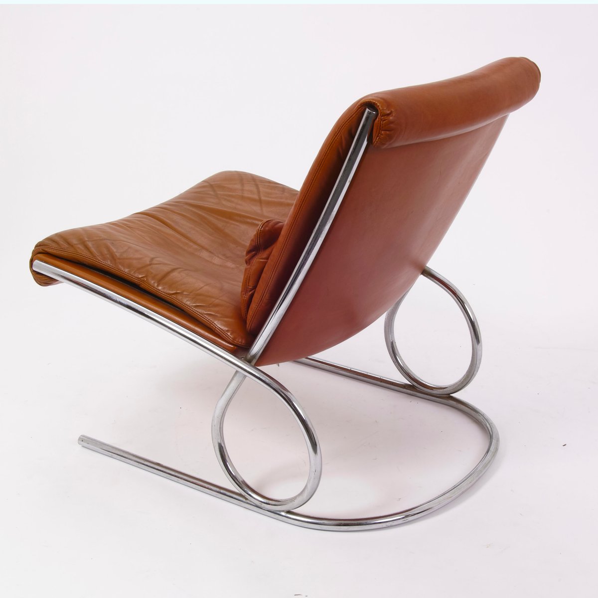 Fauteuil vintage chrome et orange en cuir en vente sur pamono