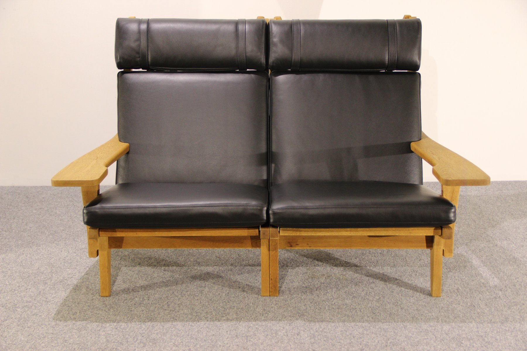 Danish Oak and Black Leather Two Seater Sofa from Getama 1960s